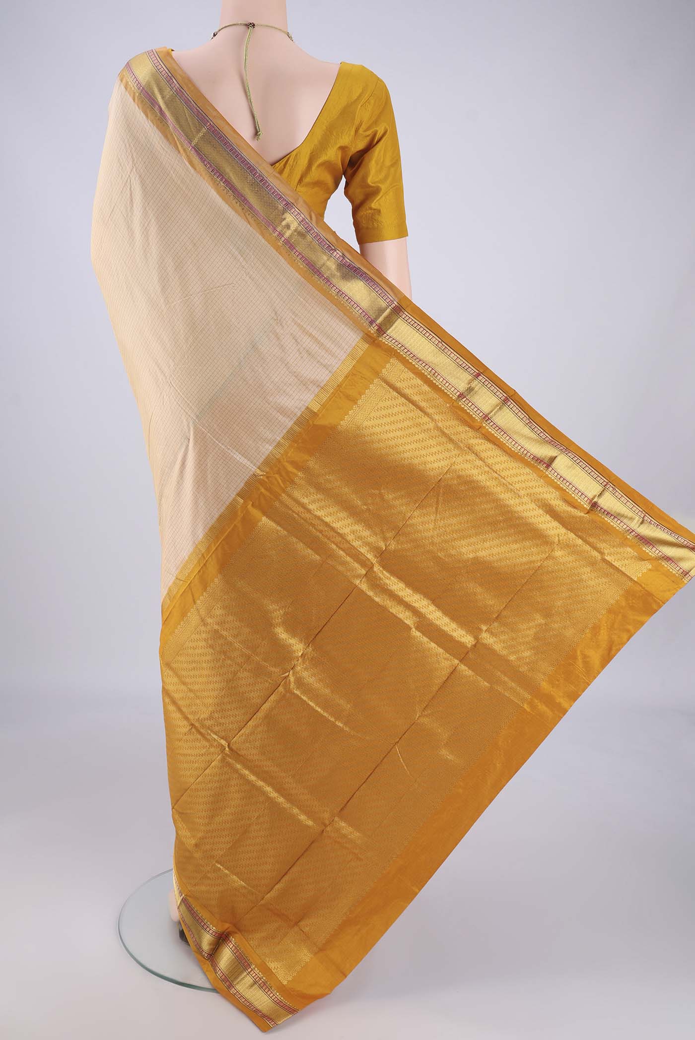 Flat view of Cream Narayanpet Silk Saree with Checked design on the body and Zari Border. 