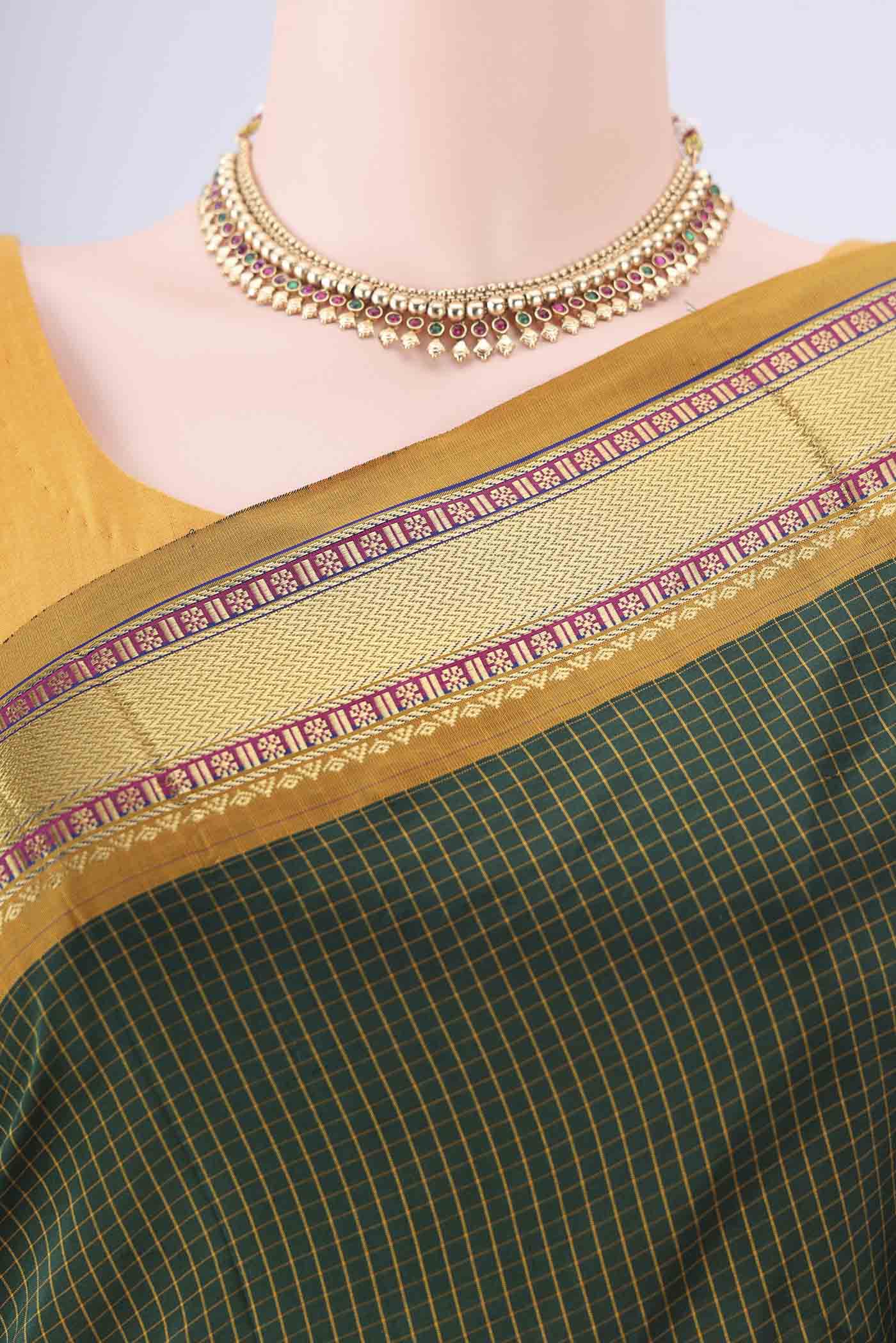 Border image of Bottle Green Narayanpet Silk Saree with Checked design on the body and Zari Border. 