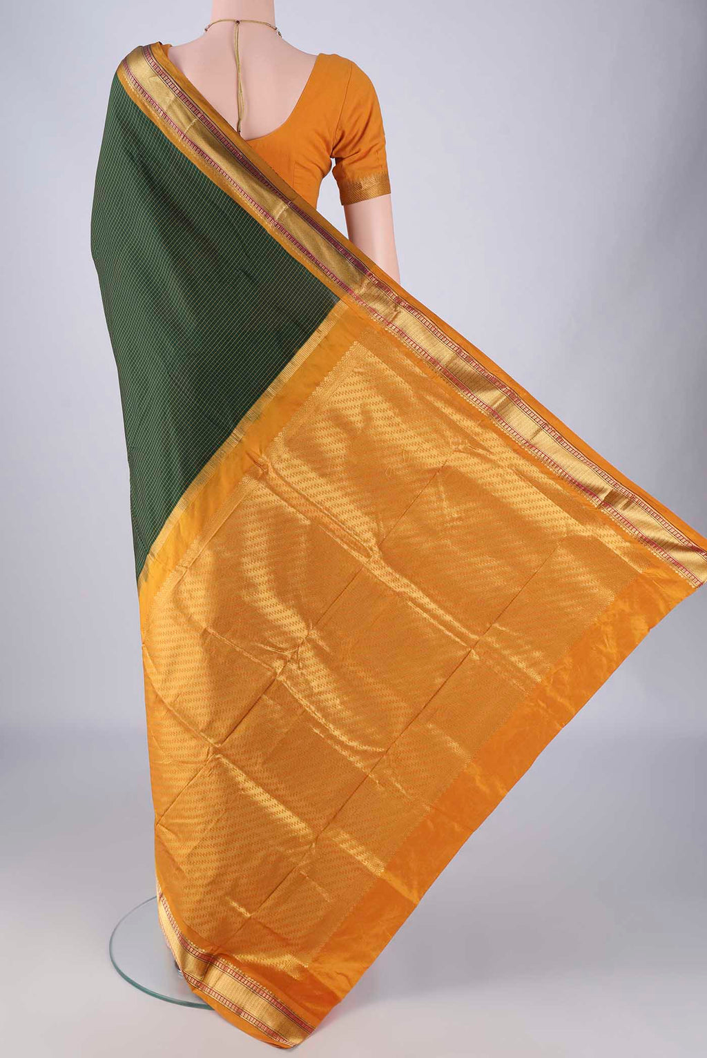 Flat view of Bottle Green Narayanpet Silk Saree with Checked design on the body and Zari Border. 