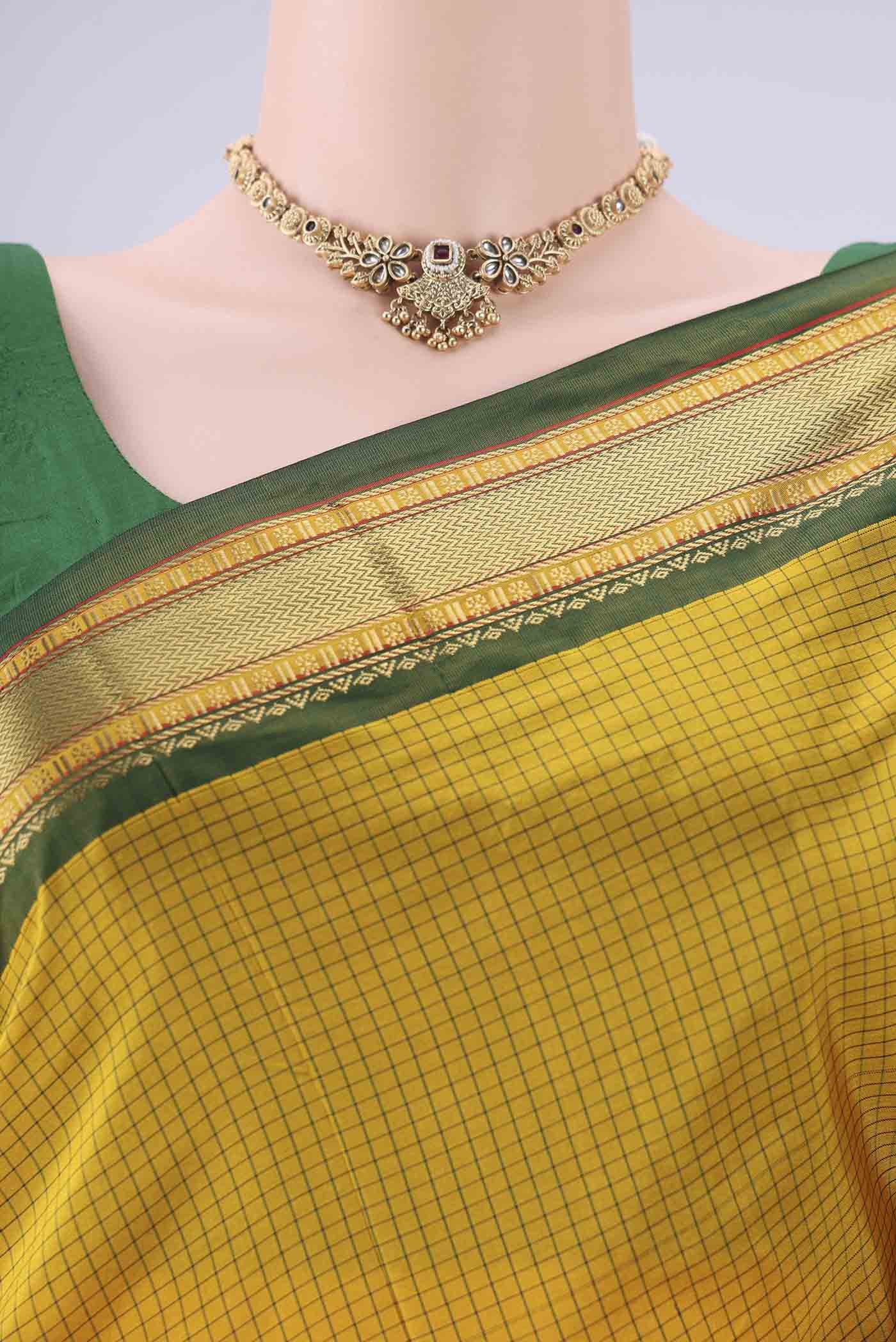 Border image of Yellow Narayanpet Silk Saree with Checked design on the body and Zari Border. 