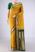 Yellow Narayanpet Silk Saree with Checked design on the body and Zari Border.  displayed on a mannequin