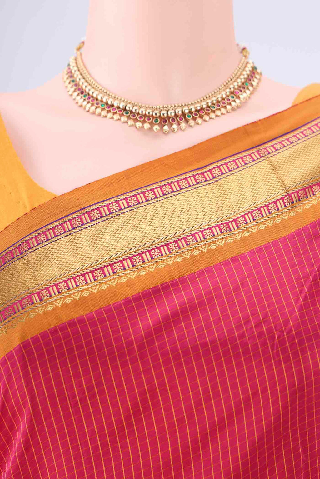 Border image of Rani Pink Narayanpet Silk Saree with Checked design on the body and Zari Border. 