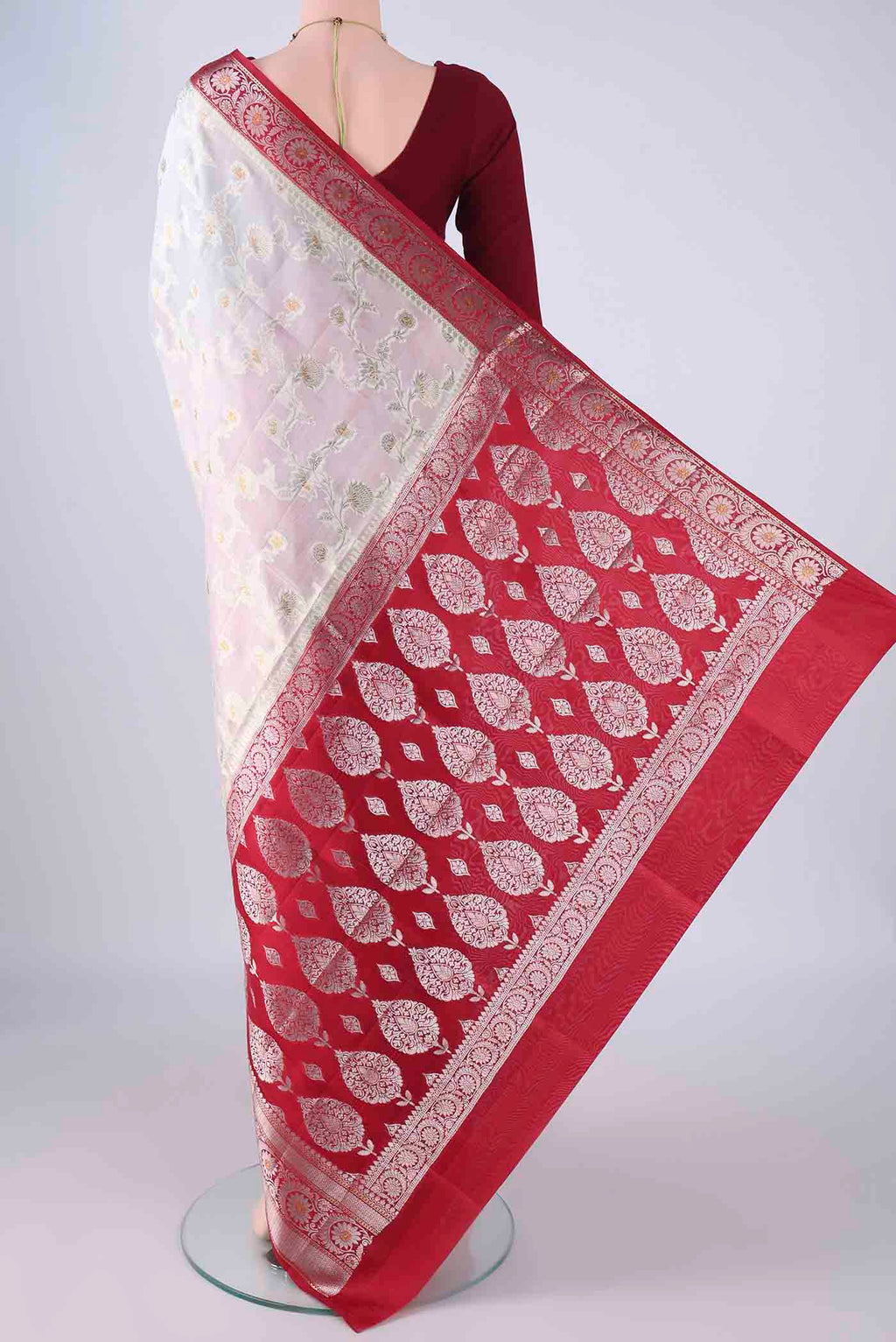 Flat view of Pearl White Banarasi Raw Silk Saree with Zari Brocade on the body and Zari Border. 