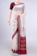 Pure Silk White Banarasi Raw Saree with Zari Butta on the body and Zari Border.  displayed on a mannequin
