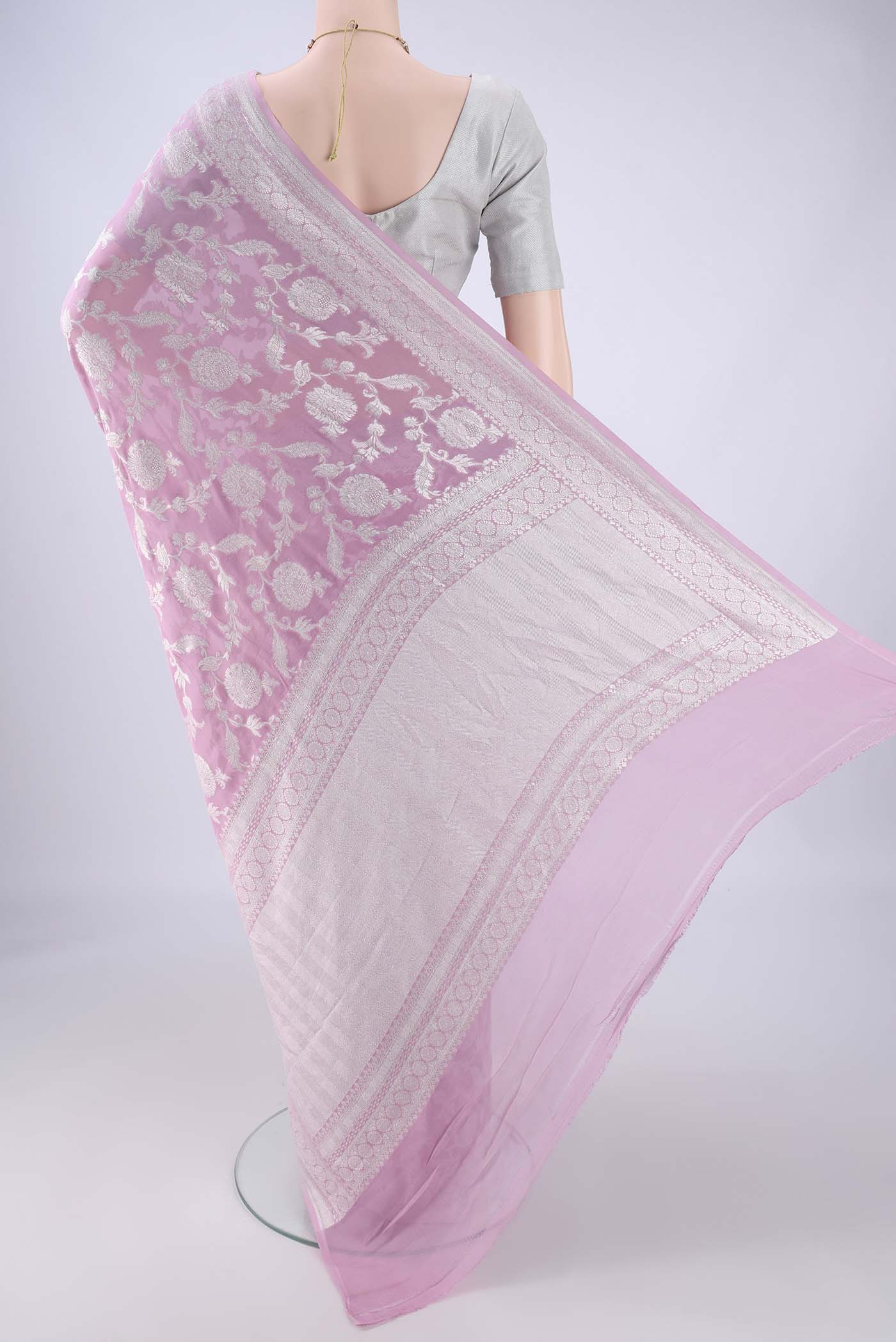 Flat view of Rose pink Banarasi Georgette Saree with Zari Brocade on the body and Zari Border. 
