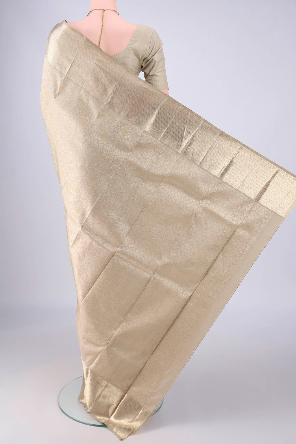 Flat view of Beige Kanjivaram Silk Saree with Zari Brocade on the body and Zari Border. 