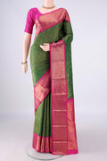 Pure Silk Green Kanchipuram Saree with Zari Brocade on the body and Zari Border.  displayed on a mannequin