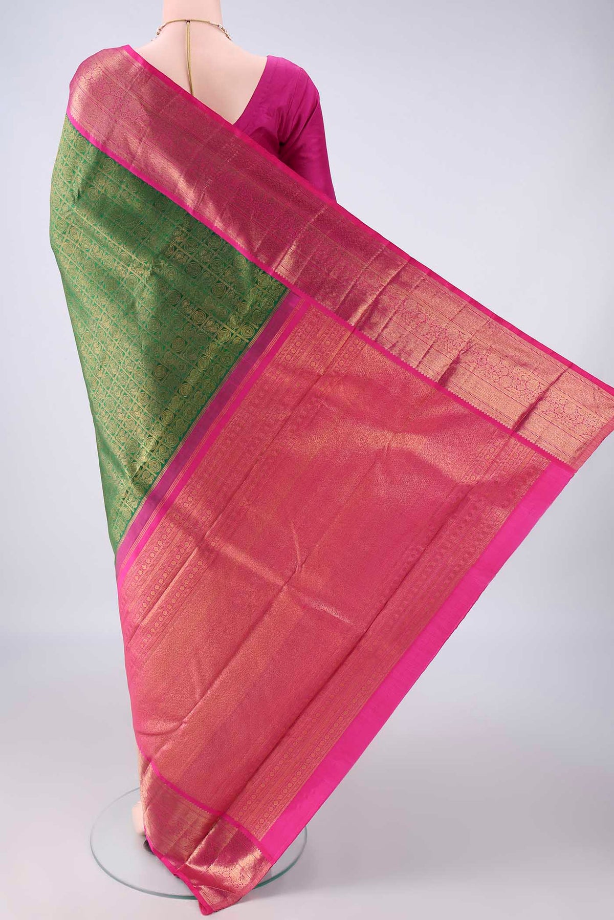 Flat view of Pure Silk Green Kanchipuram Saree with Zari Brocade on the body and Zari Border. 