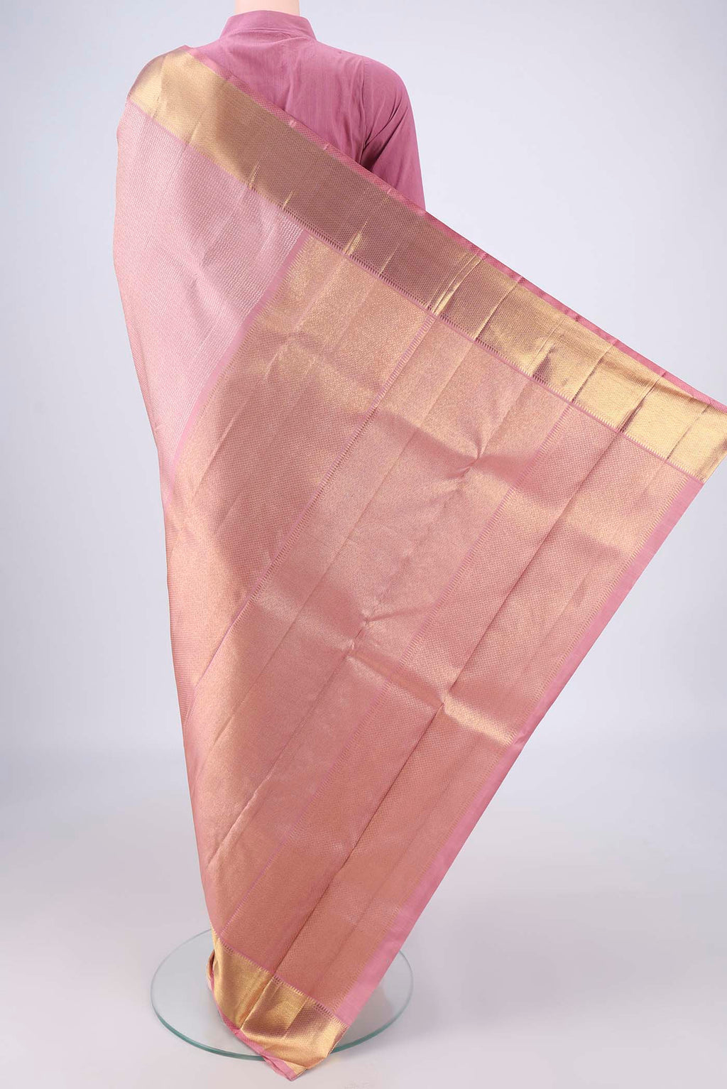 Flat view of Rose Gold Kanchipuram Silk Saree with Zari Brocade on the body and Zari Border. 