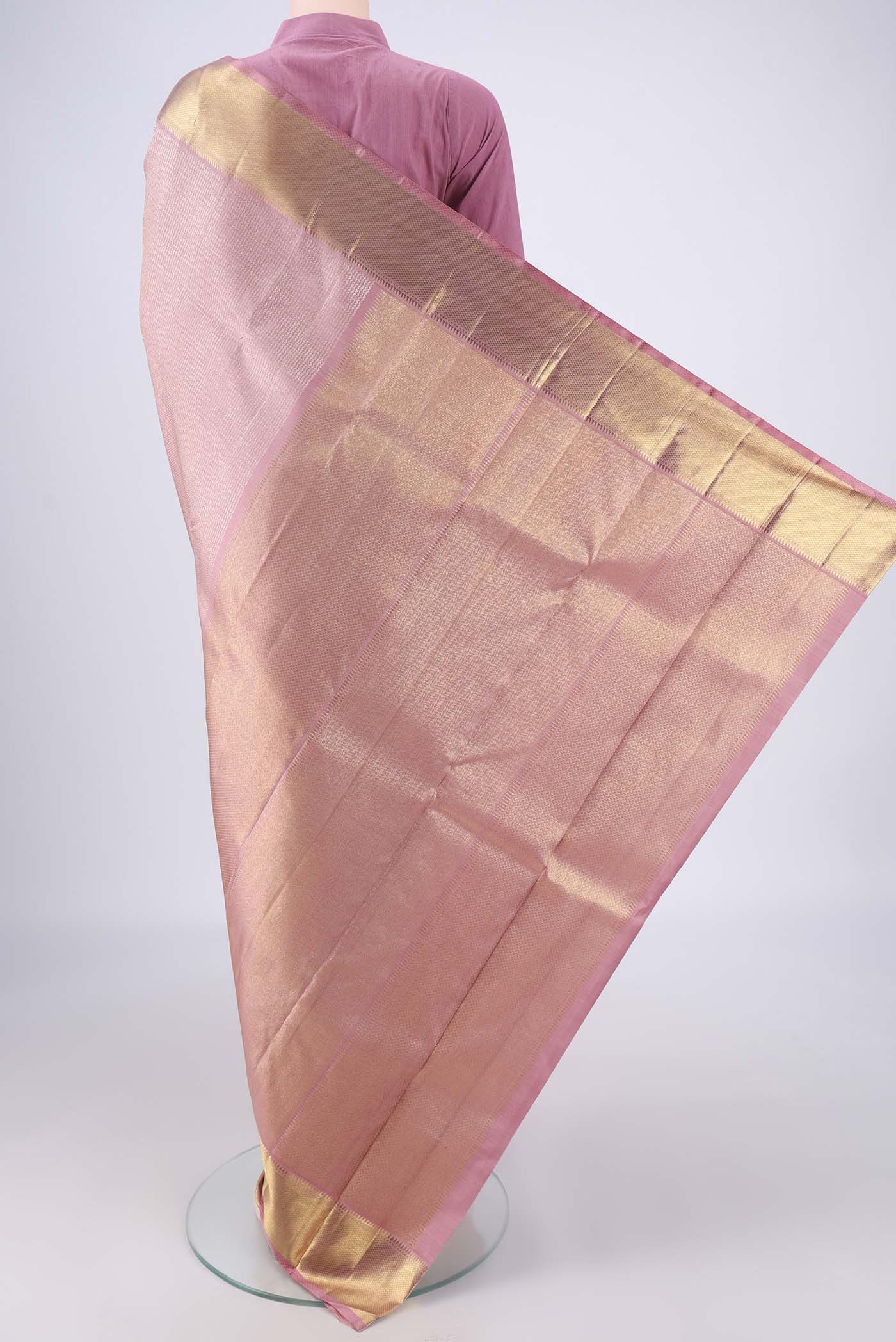 Flat view of Rose Gold Kanchipuram Silk Saree with Zari Brocade on the body and Zari Border. 