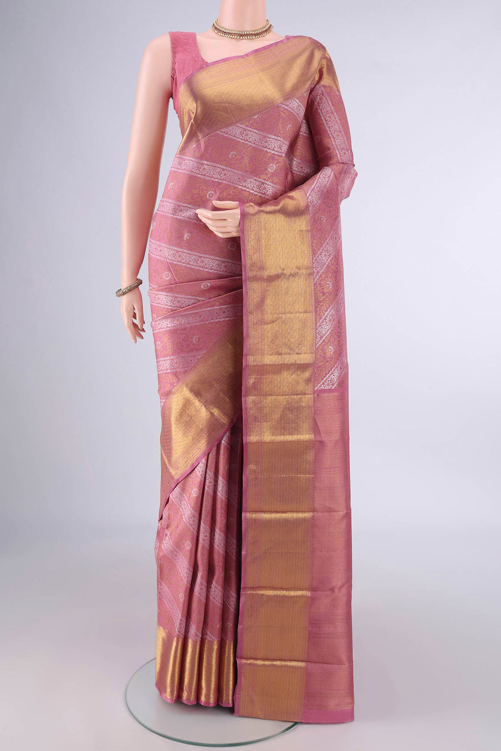 Pure Silk Pure Zari Mauve Kanjivaram Saree with Zari Brocade on the body and Zari Border.  displayed on a mannequin
