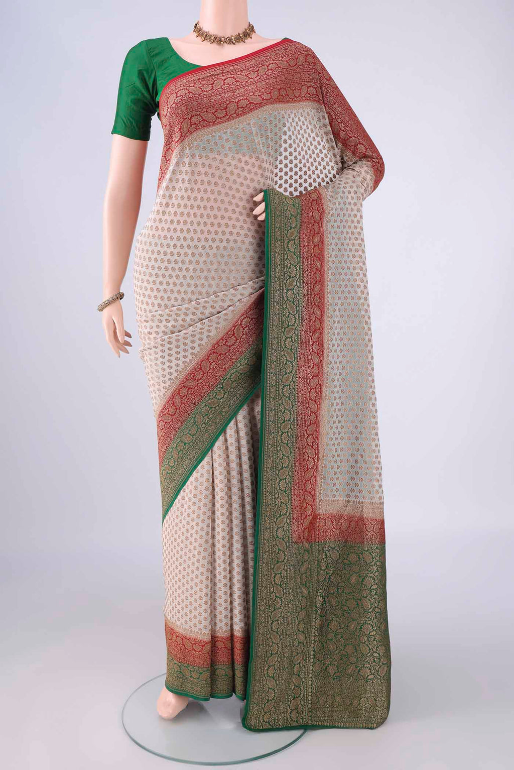 Beige Banarasi Georgette Saree with Zari Butta on the body and Zari Border.  displayed on a mannequin