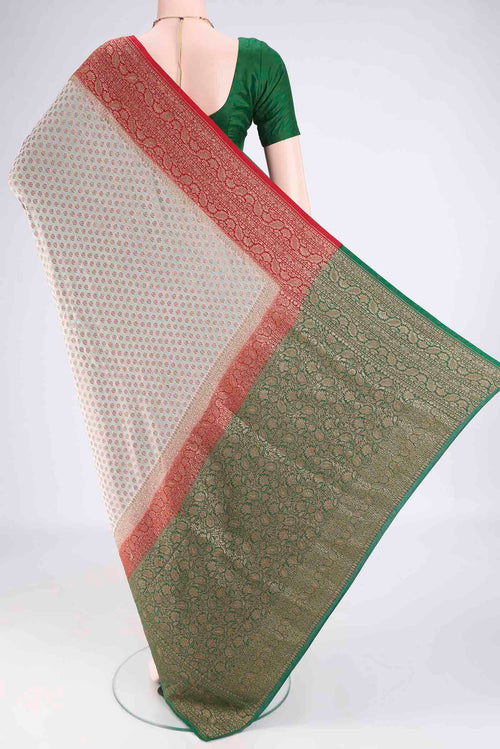 Flat view of Beige Banarasi Georgette Saree with Zari Butta on the body and Zari Border. 