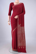 Maroon Banarasi Georgette Saree with Zari Butta on the body and Zari Border.  displayed on a mannequin