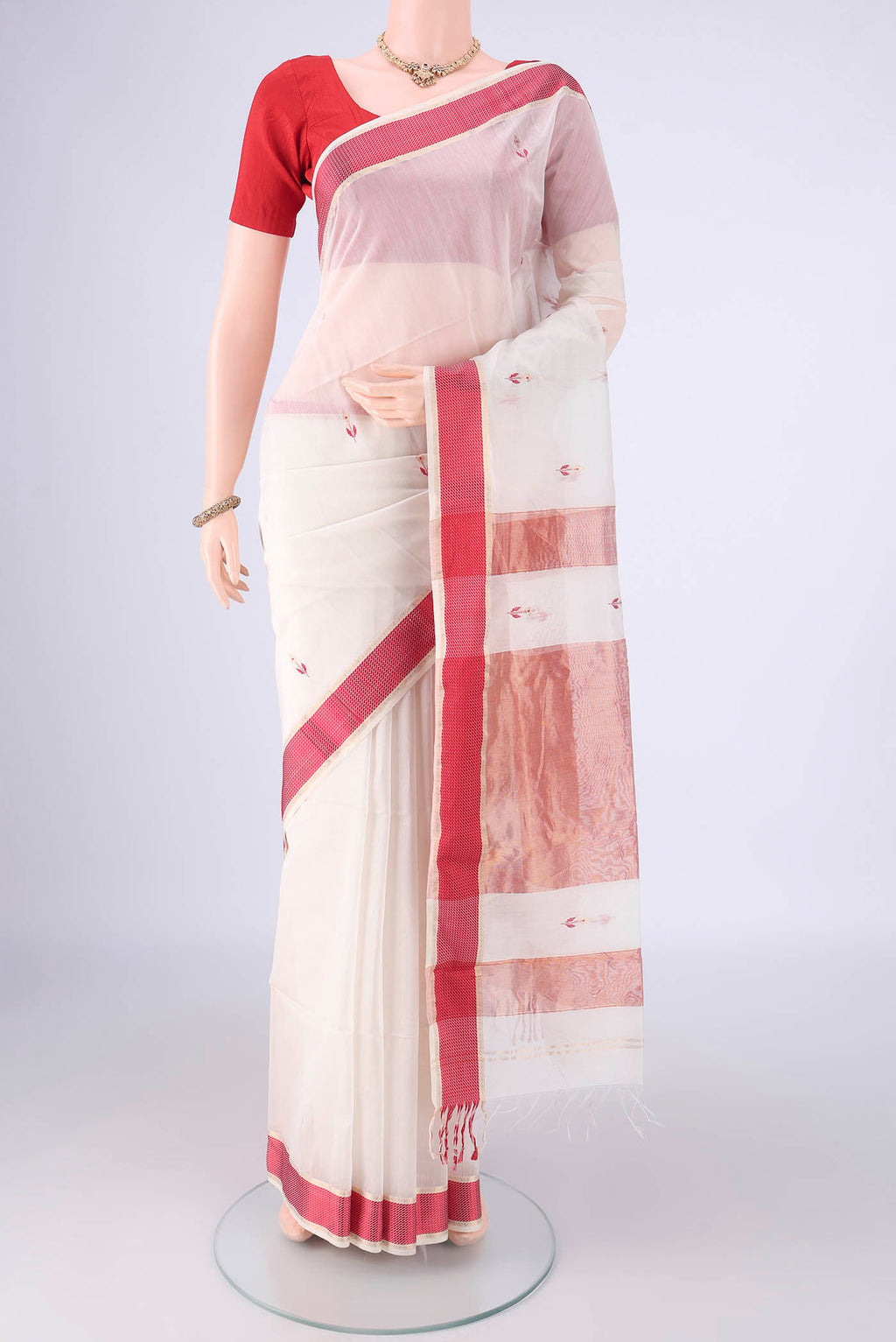 White Maheshwari Silk Cotton Saree with Thread Butta on the body and Thread Border.  displayed on a mannequin