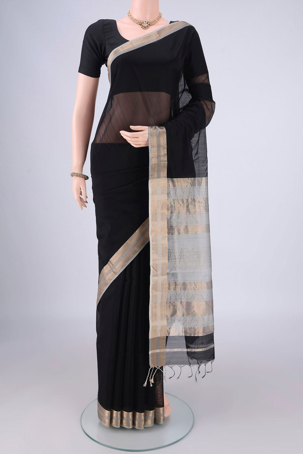 Black Maheshwari Silk Cotton Saree with Plain Body and Zari Border.  displayed on a mannequin