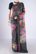 Black Linen Saree with Printed design on the body and Zari Border.  displayed on a mannequin