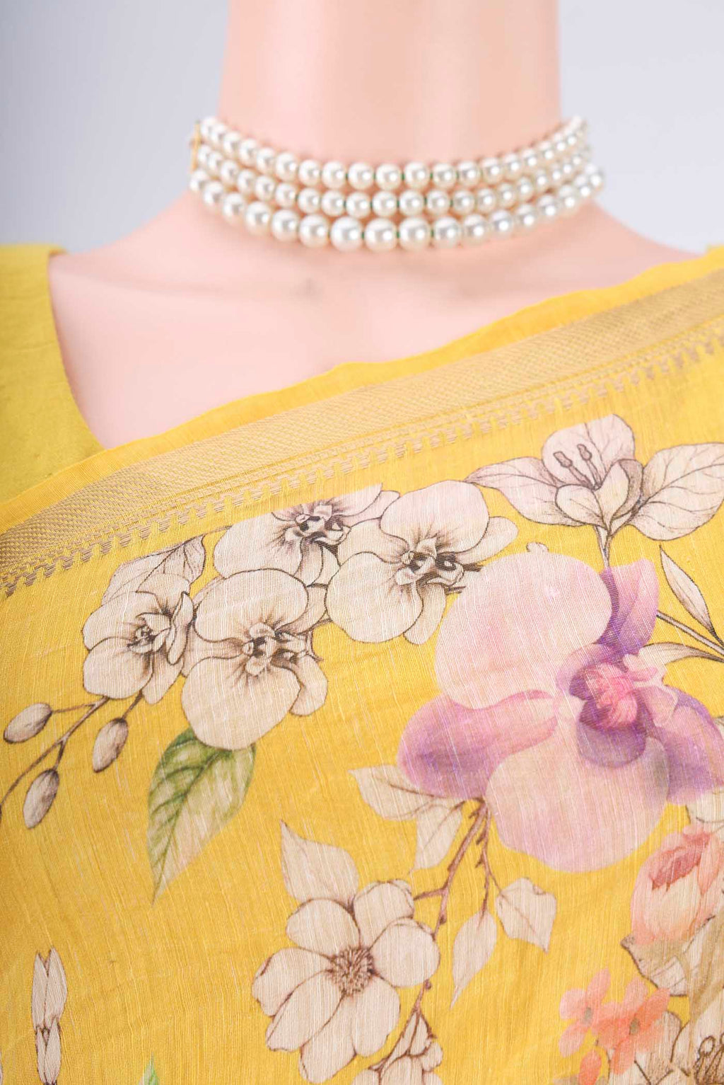 Border image of Lemon Yellow Linen Saree with Printed design on the body and Zari Border. 