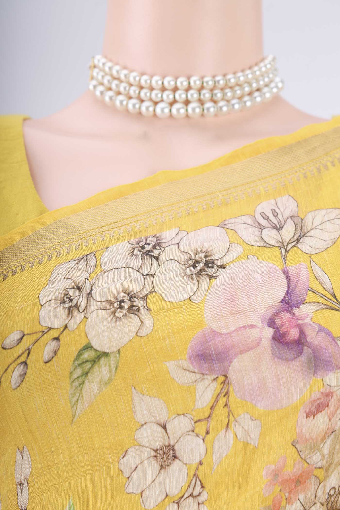 Border image of Lemon Yellow Linen Saree with Printed design on the body and Zari Border. 