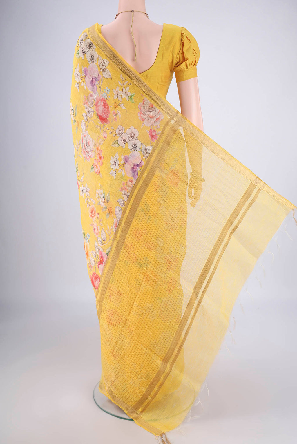 Flat view of Lemon Yellow Linen Saree with Printed design on the body and Zari Border. 