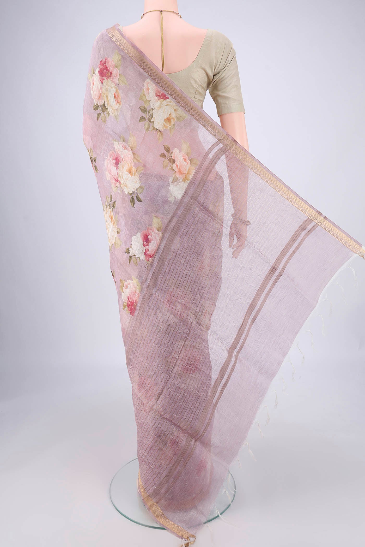 Flat view of Mauve Linen Saree with Printed design on the body and Zari Border. 