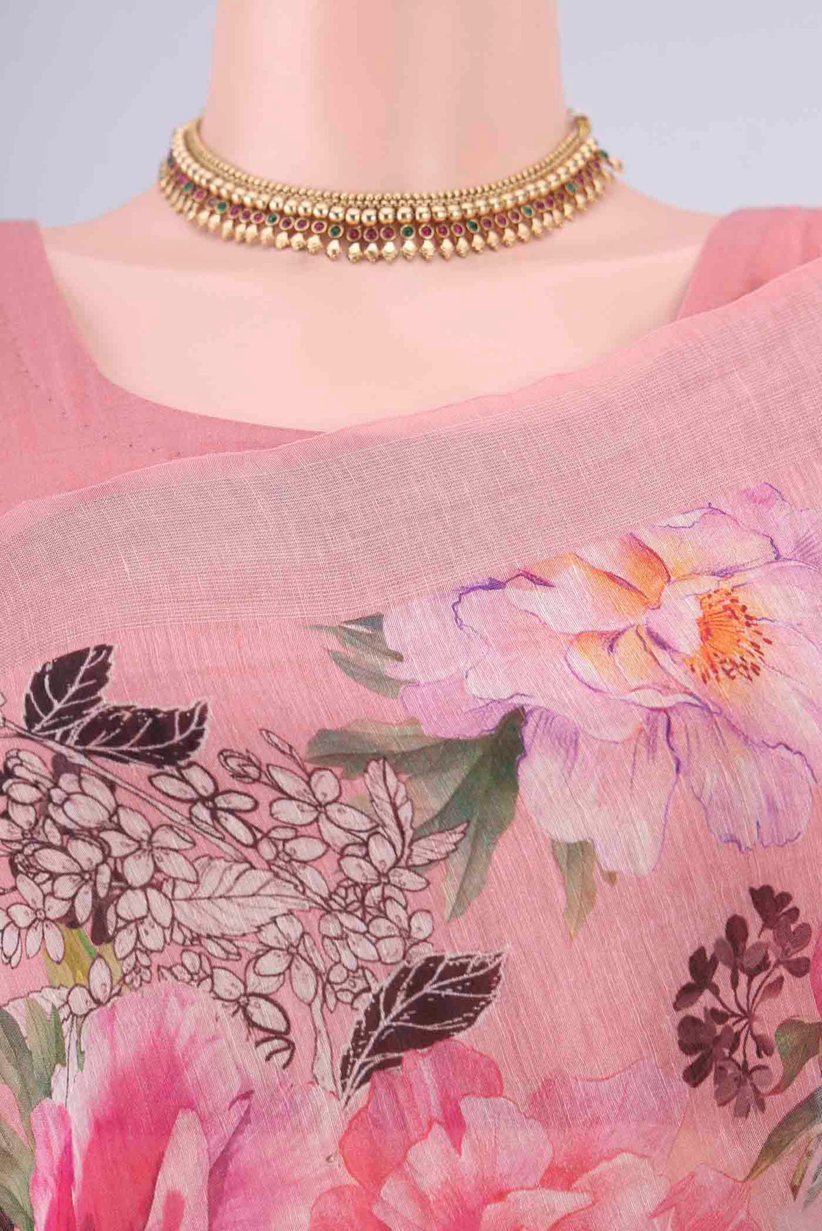 Border image of Peach Linen Saree with Floral Print on the body and Zari Border. 