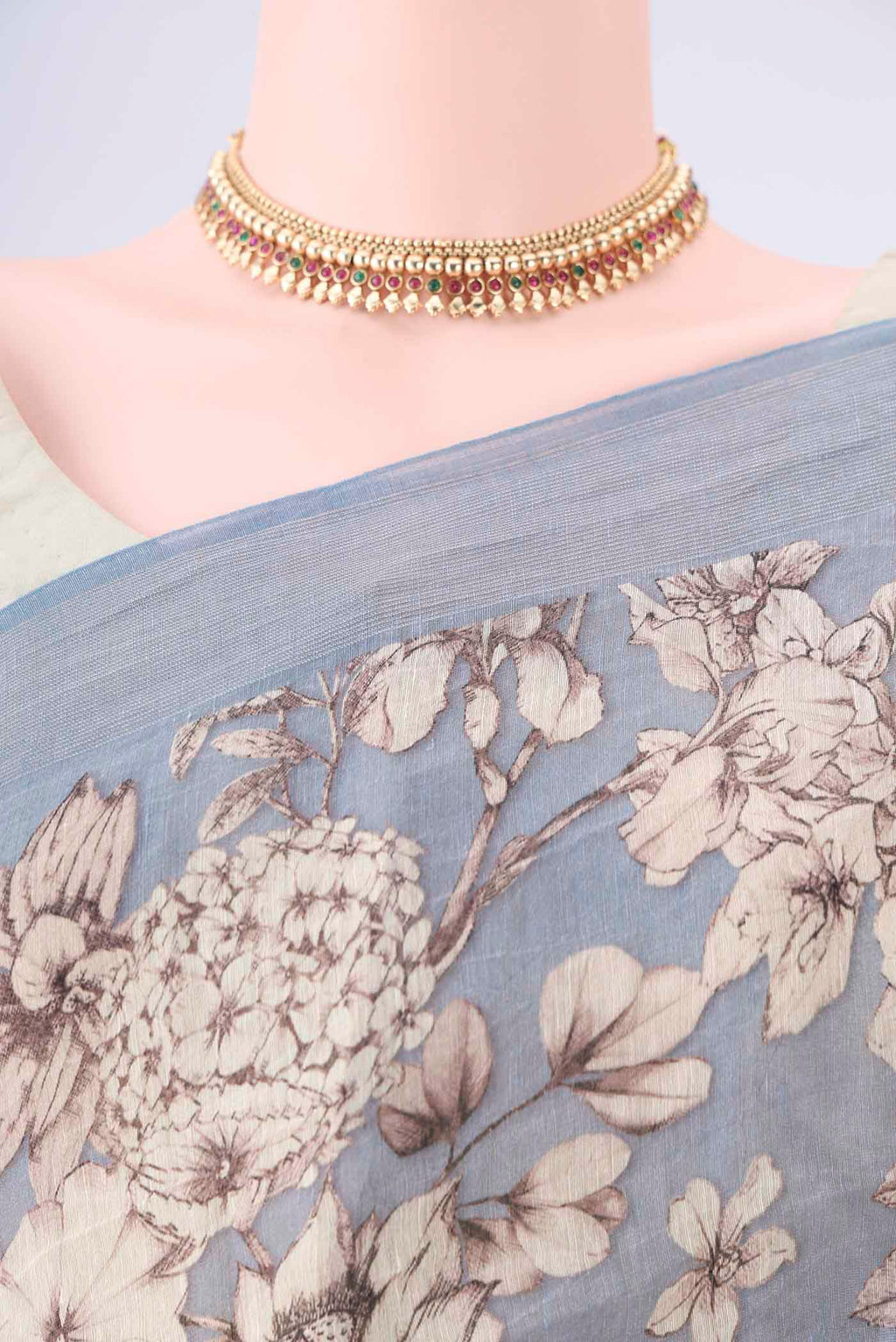 Border image of Blue Grey Linen Saree with Printed design on the body and Zari Border. 