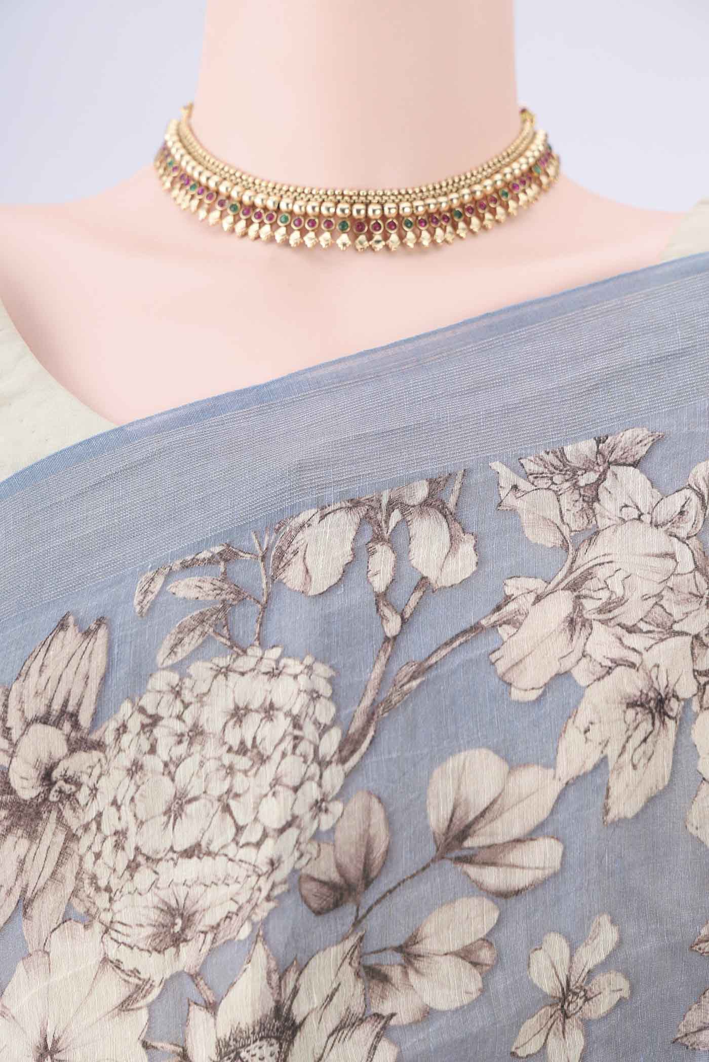 Border image of Blue Grey Linen Saree with Printed design on the body and Zari Border. 