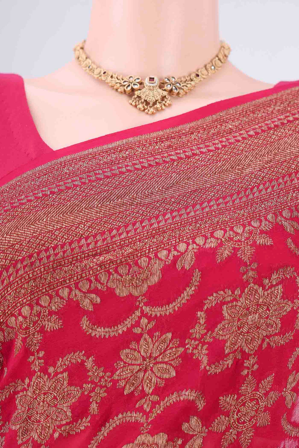 Border image of Rani Pink Banarasi Georgette Saree with Zari Brocade on the body and Zari Border. 