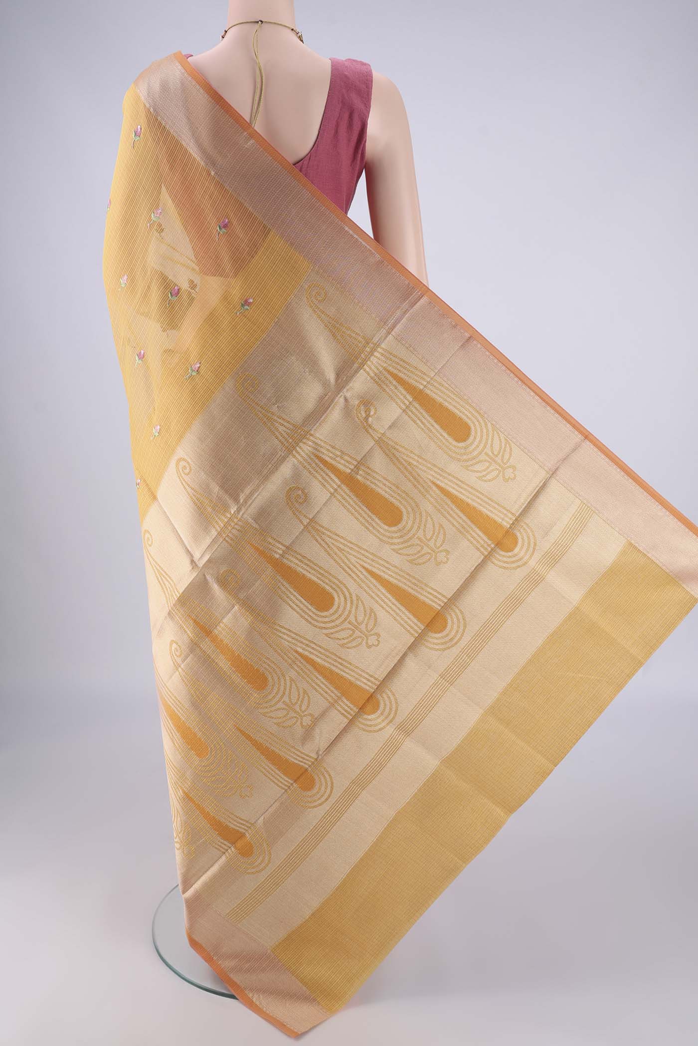 Flat view of Mustard Kota Cotton Saree with Embroidery on the body and Zari Border. 