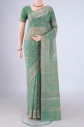 Light Green Blended Kota Cotton Saree with Embroidery on the body and Zari Border.  displayed on a mannequin