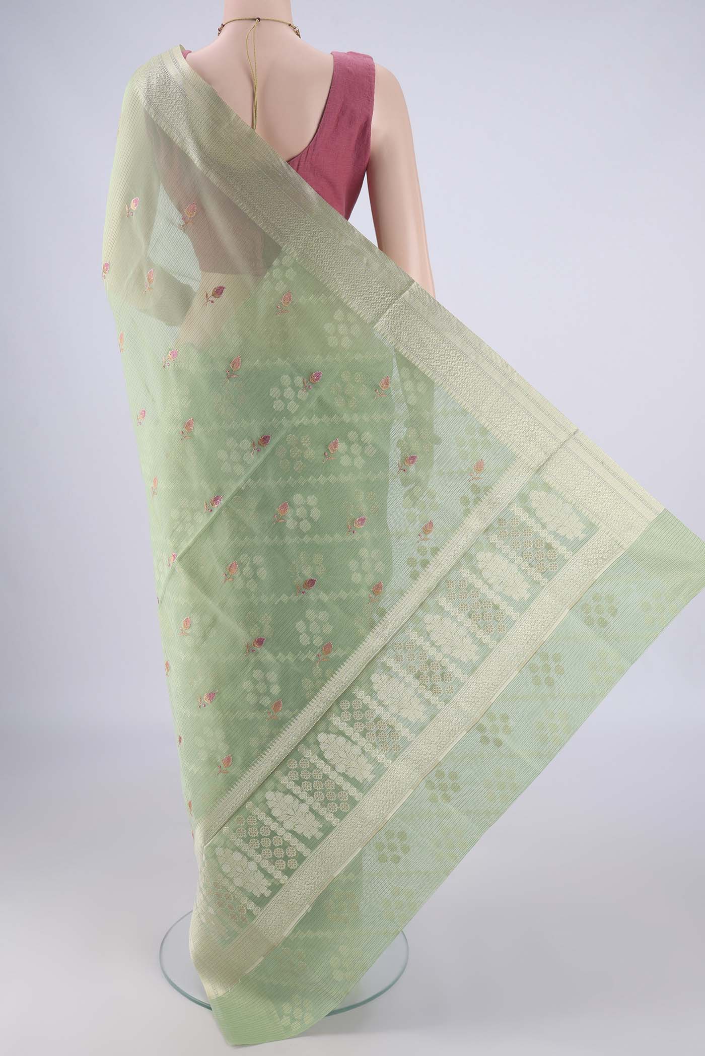 Flat view of Light Green Blended Kota Cotton Saree with Embroidery on the body and Zari Border. 