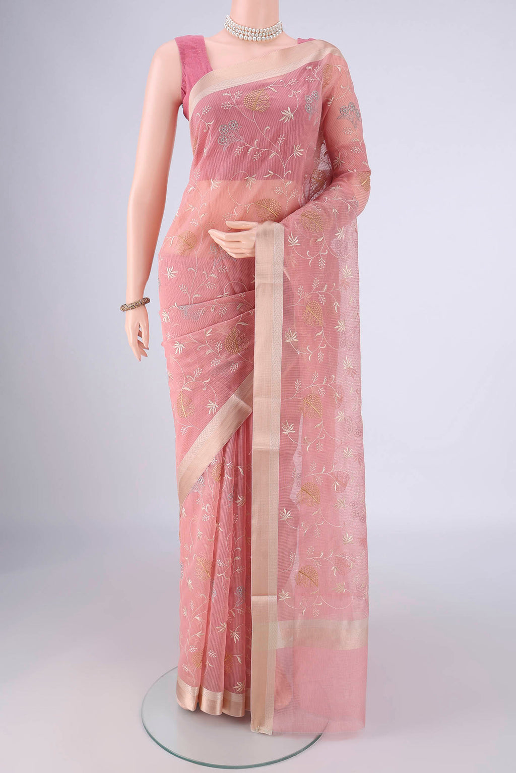 Rose pink Blended Kota Cotton Saree with Embroidery on the body and Zari Border.  displayed on a mannequin