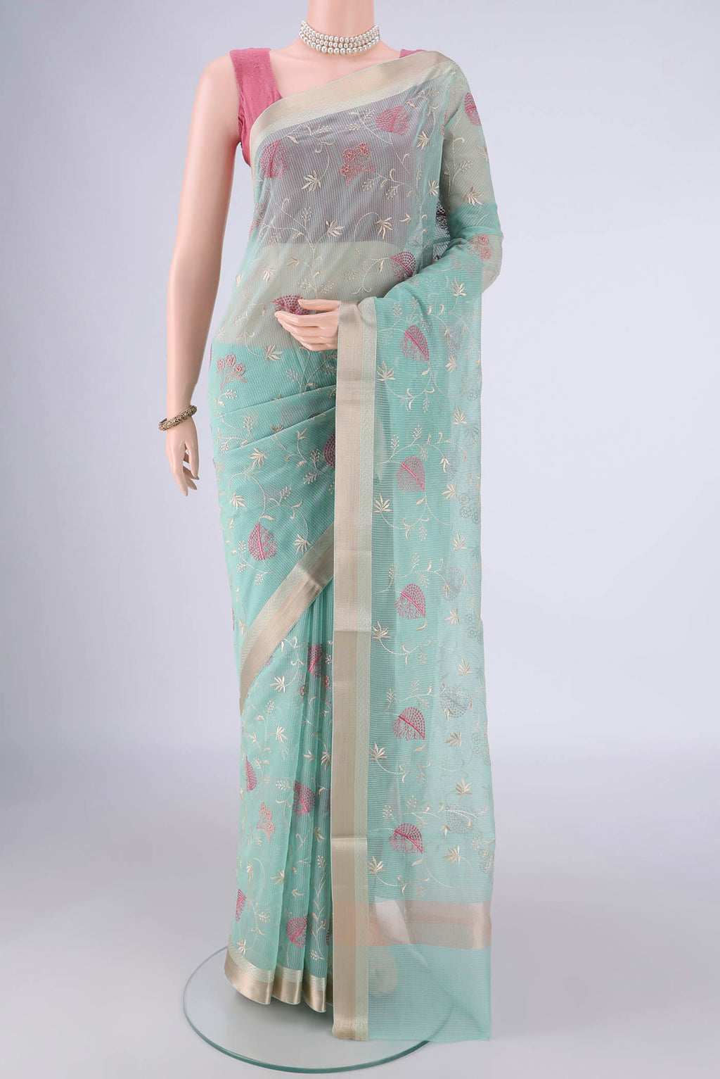 Light Blue Blended Kota Cotton Saree with Embroidery on the body and Zari Border.  displayed on a mannequin