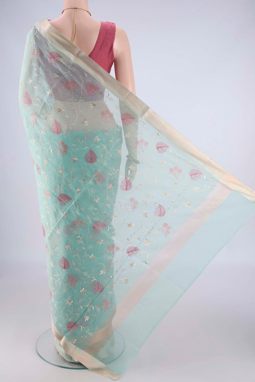 Flat view of Light Blue Blended Kota Cotton Saree with Embroidery on the body and Zari Border. 
