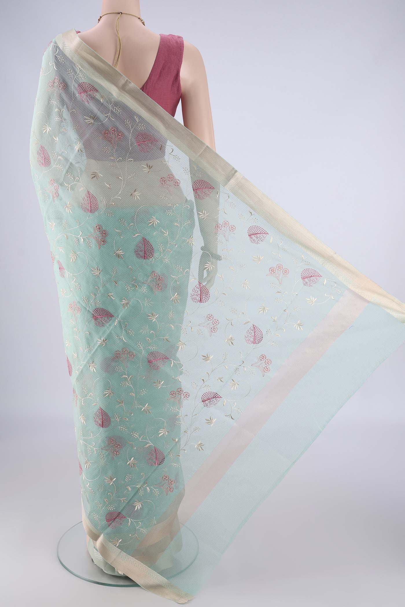 Flat view of Light Blue Blended Kota Cotton Saree with Embroidery on the body and Zari Border. 