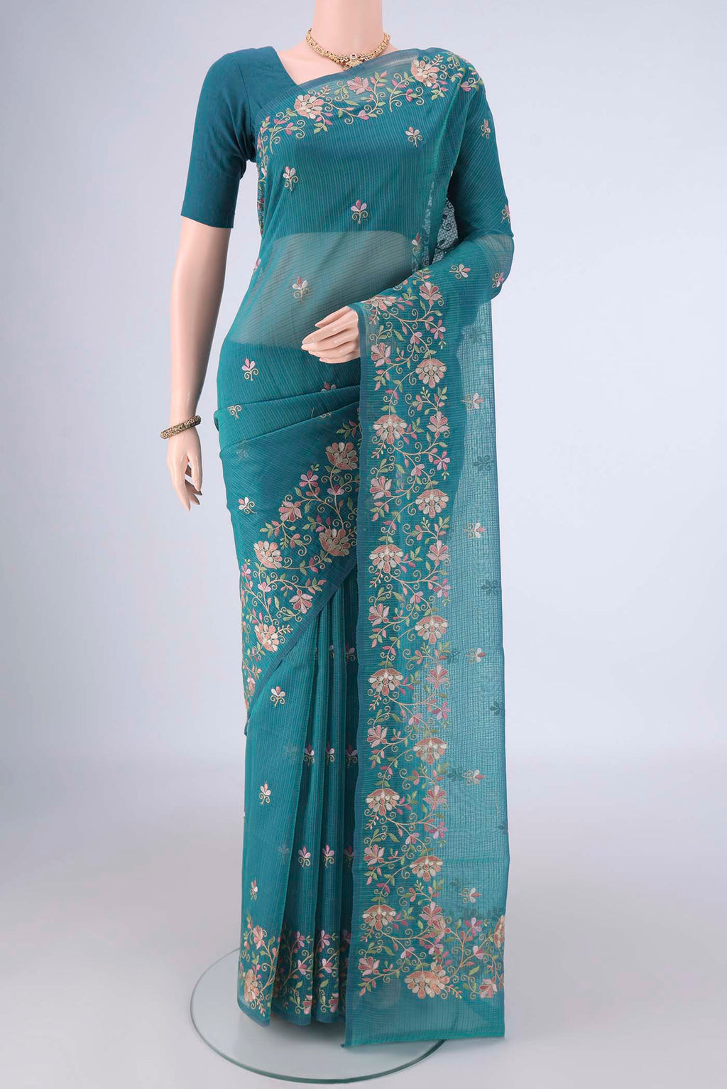 Peacock Blue Blended Kota Cotton Saree with Embroidery on the body and Embroidery Border.  displayed on a mannequin