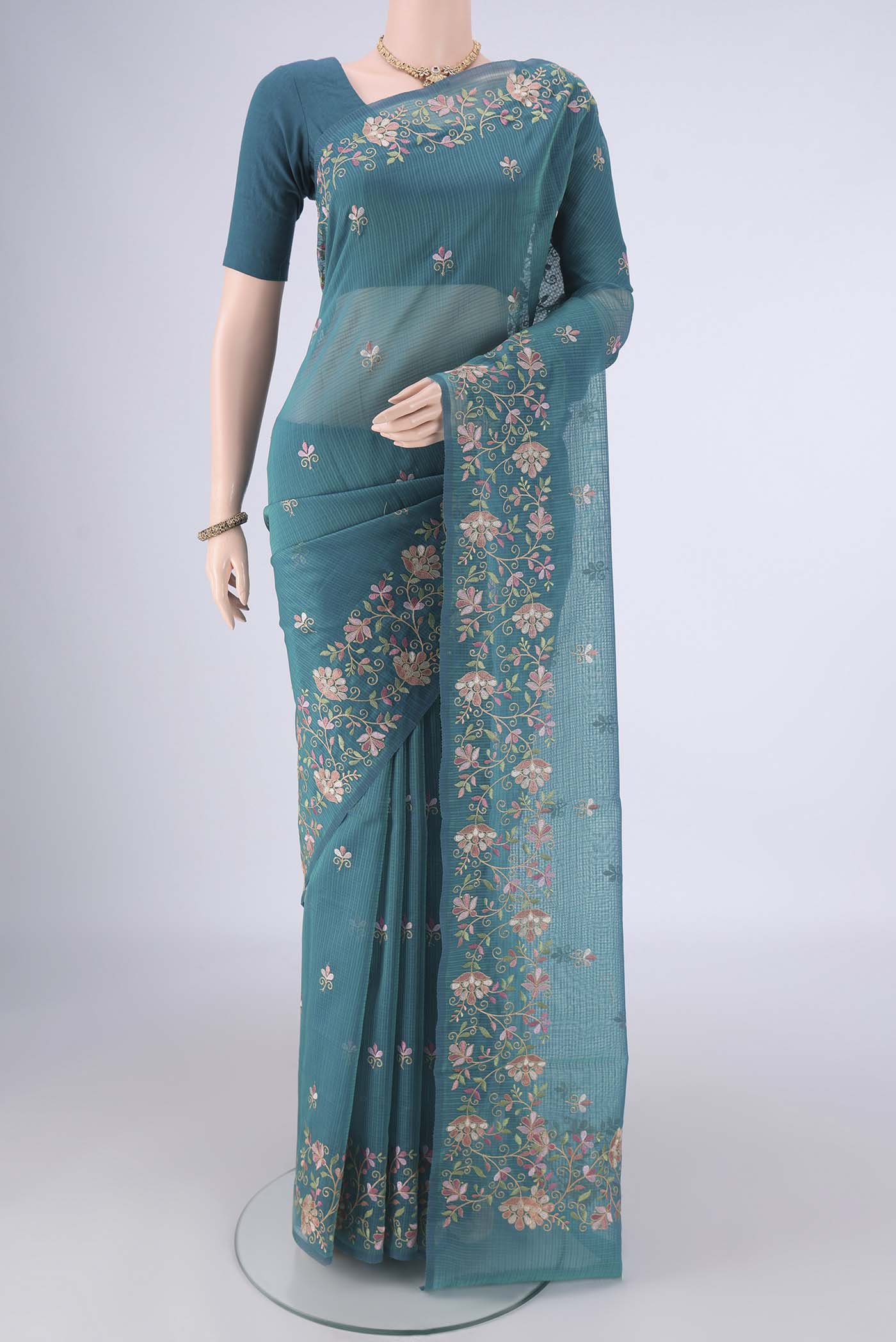 Peacock Blue Blended Kota Cotton Saree with Embroidery on the body and Embroidery Border.  displayed on a mannequin