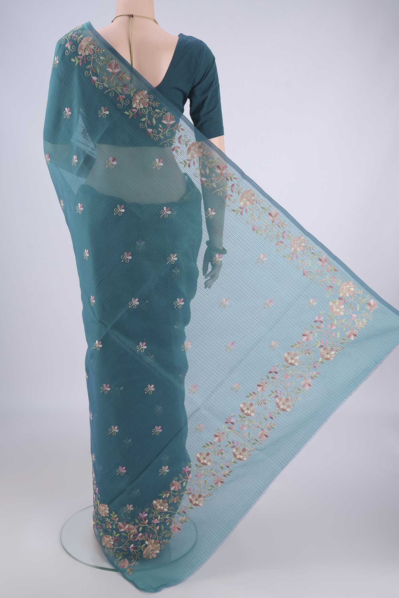 Flat view of Peacock Blue Blended Kota Cotton Saree with Embroidery on the body and Embroidery Border. 
