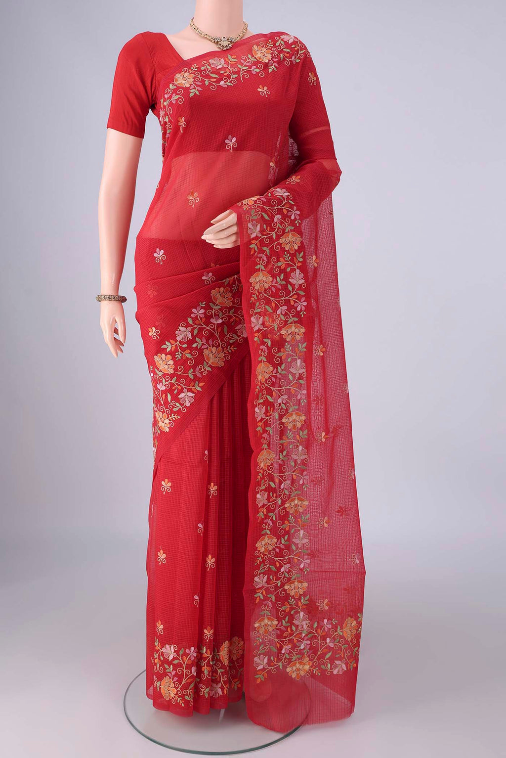 Red Blended Kota Cotton Saree with Embroidery on the body and Embroidery Border.  displayed on a mannequin