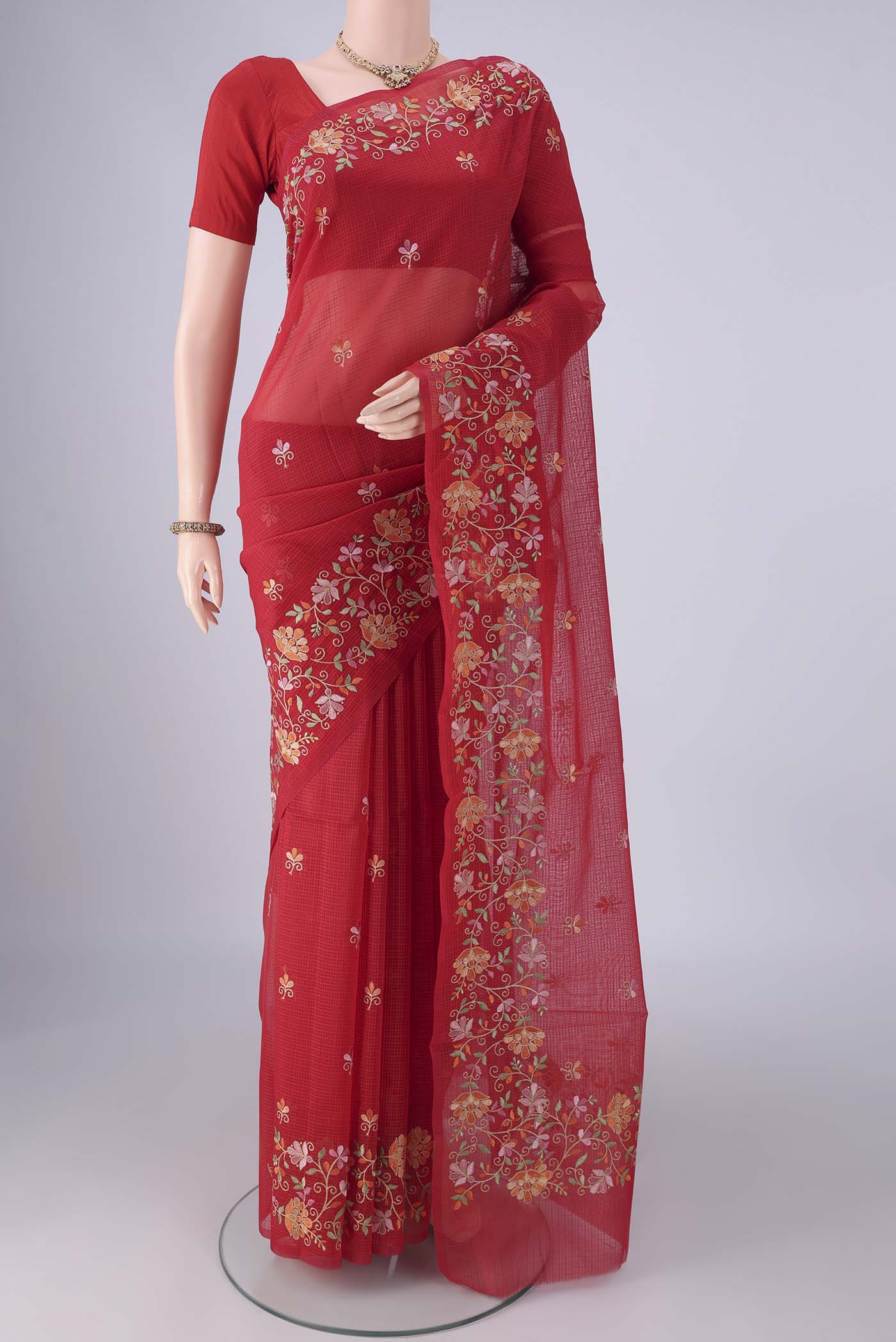 Red Blended Kota Cotton Saree with Embroidery on the body and Embroidery Border.  displayed on a mannequin