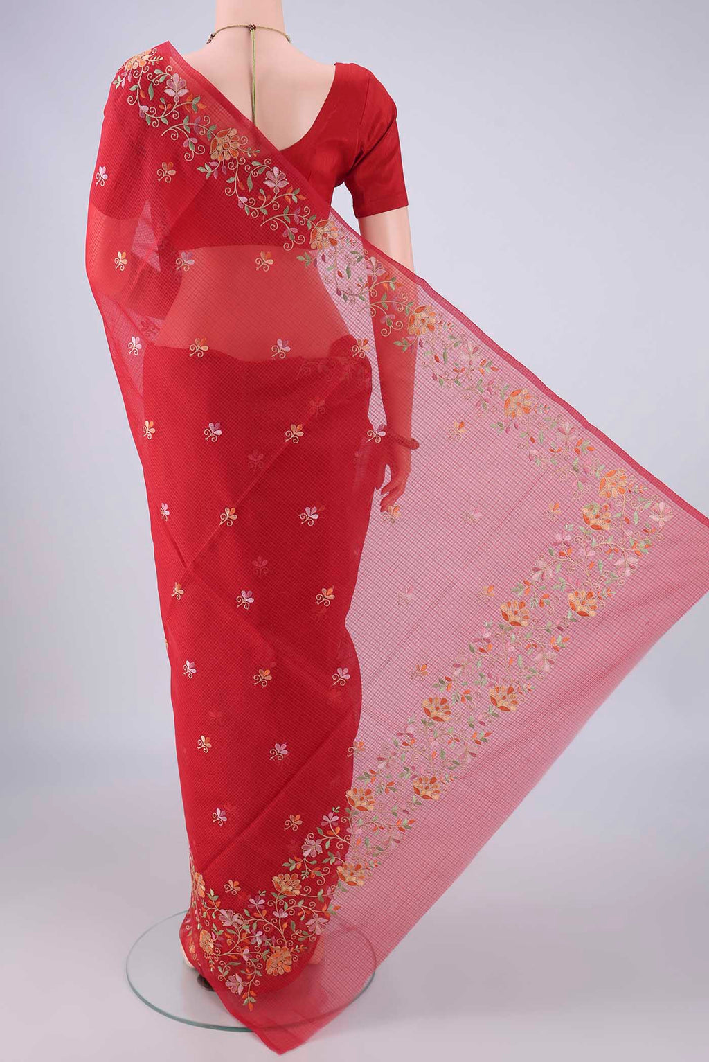 Flat view of Red Blended Kota Cotton Saree with Embroidery on the body and Embroidery Border. 