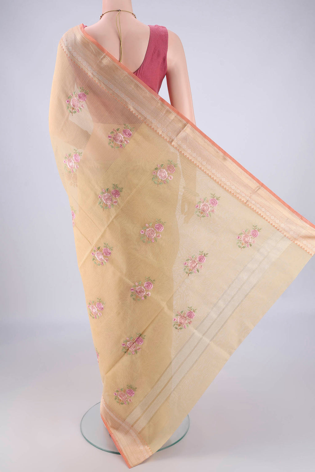 Flat view of Beige Blended Kota Cotton Saree with Embroidery on the body and Zari Border. 