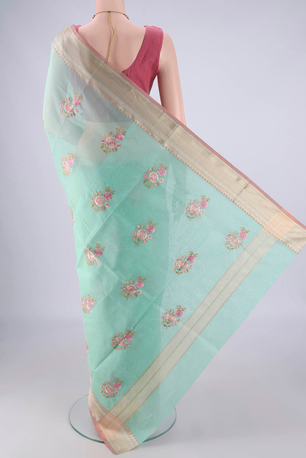 Flat view of Turquoise Blended Kota Cotton Saree with Embroidery on the body and Zari Border. 
