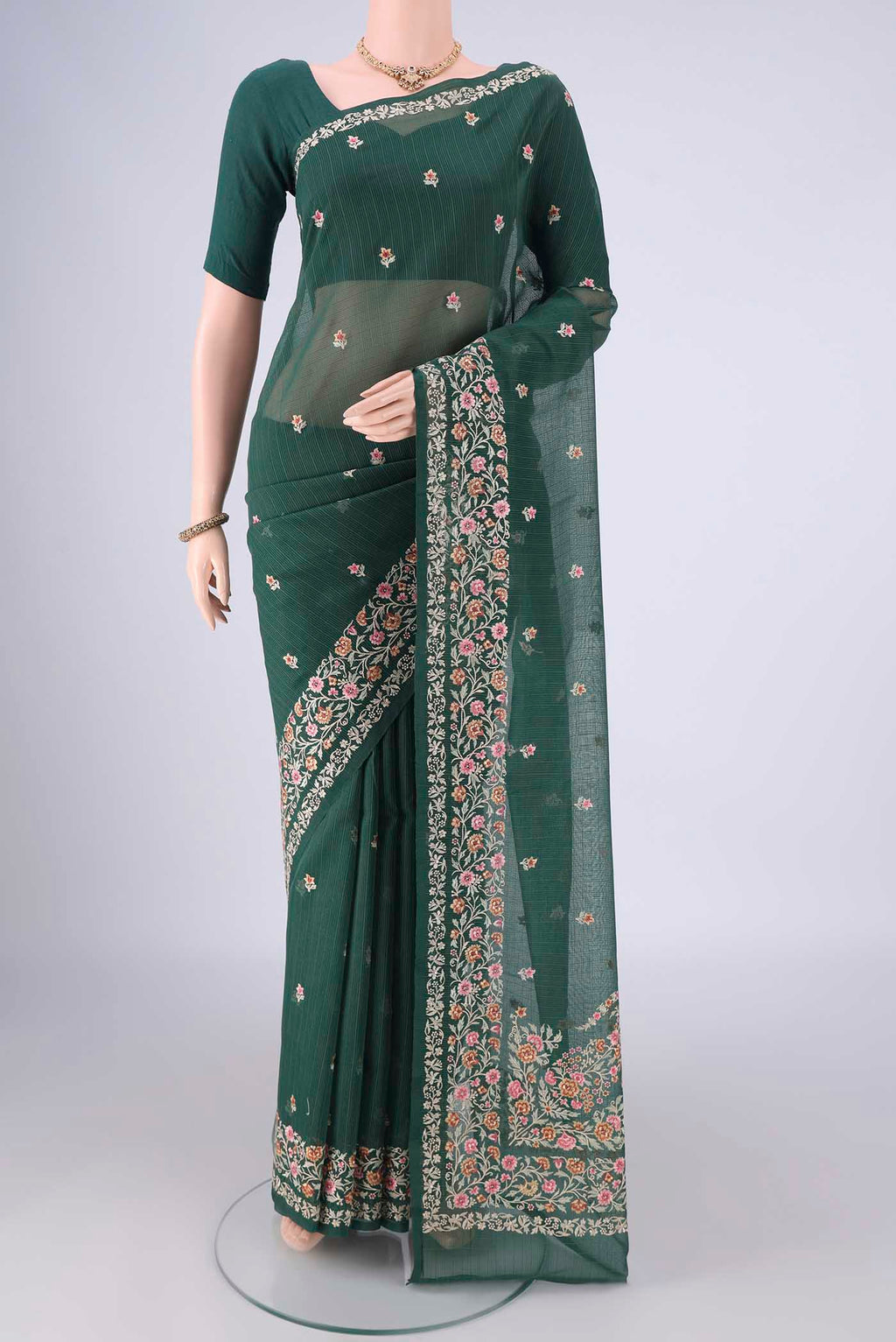 Bottle Green Blended Kota Cotton Saree with Embroidery on the body and Embroidery Border.  displayed on a mannequin