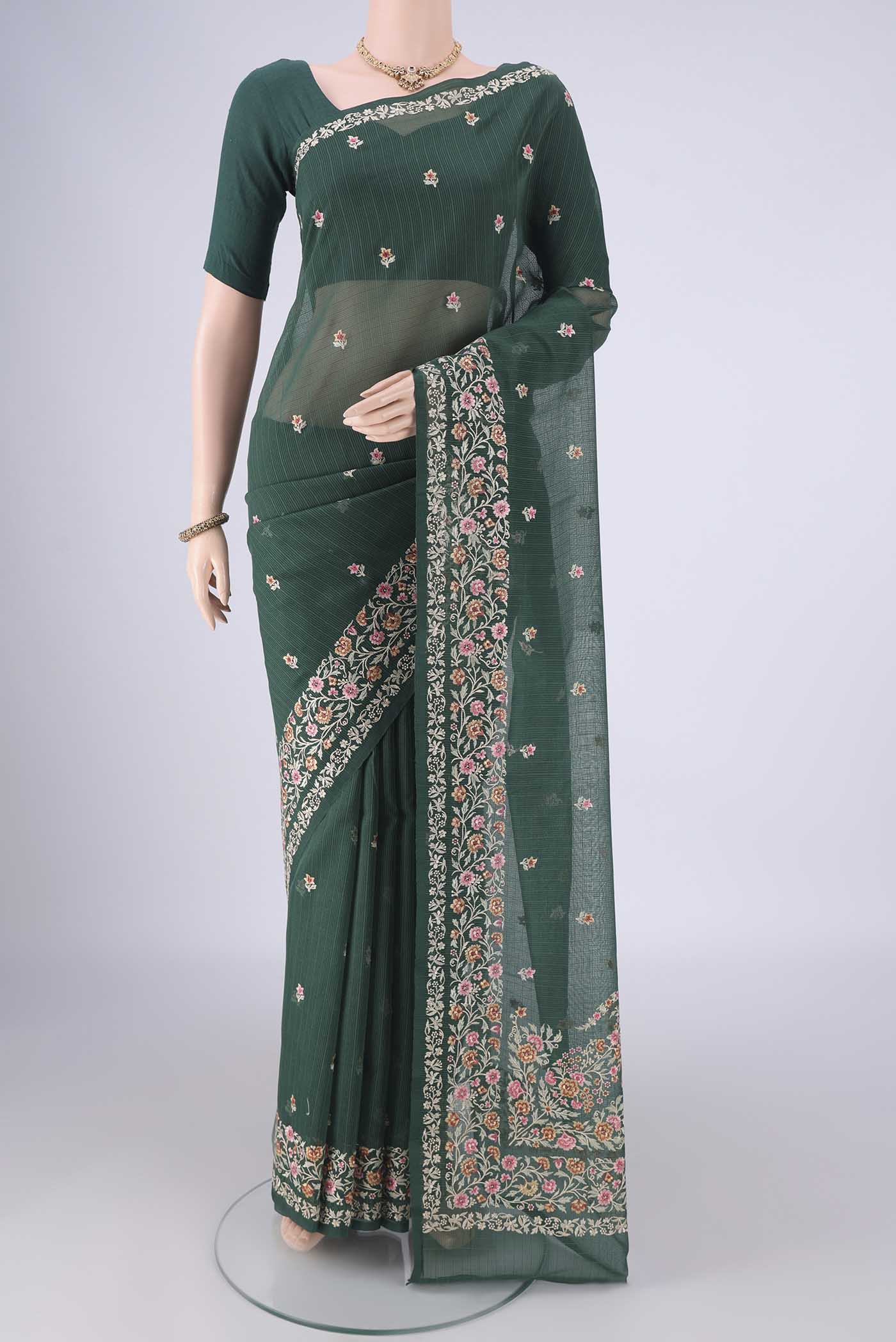 Bottle Green Blended Kota Cotton Saree with Embroidery on the body and Embroidery Border.  displayed on a mannequin