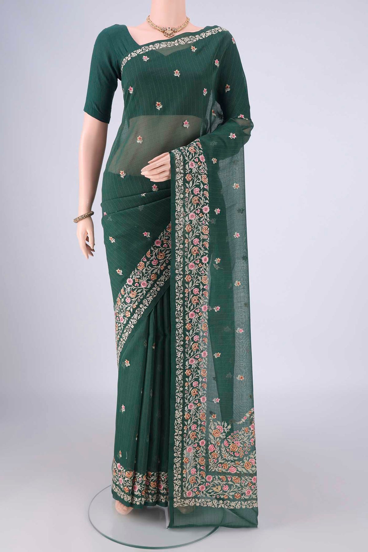 Bottle Green Blended Kota Cotton Saree with Embroidery on the body and Embroidery Border.  displayed on a mannequin