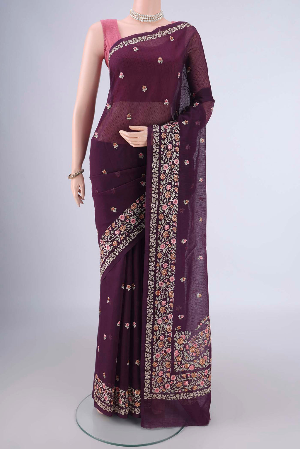 Burgundy Blended Kota Cotton Saree with Embroidery on the body and Embroidery Border.  displayed on a mannequin