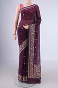 Burgundy Blended Kota Cotton Saree with Embroidery on the body and Embroidery Border.  displayed on a mannequin