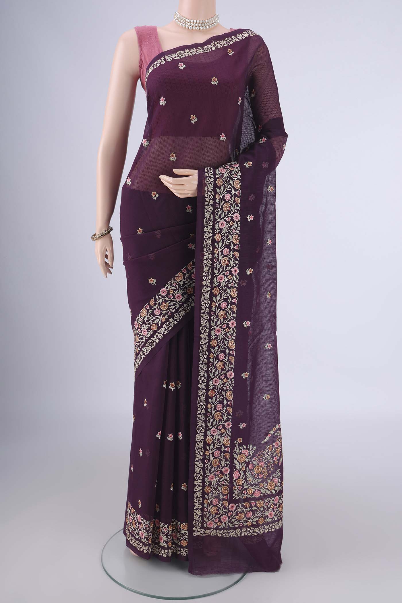 Burgundy Blended Kota Cotton Saree with Embroidery on the body and Embroidery Border.  displayed on a mannequin
